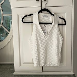 Brand new & never worn, creamed colored tank with a collar